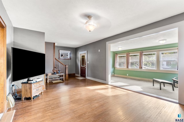 interior space featuring hardwood / wood-style floors and ceiling fan