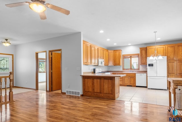 kitchen with recessed lighting, white appliances, visible vents, light countertops, and light wood finished floors