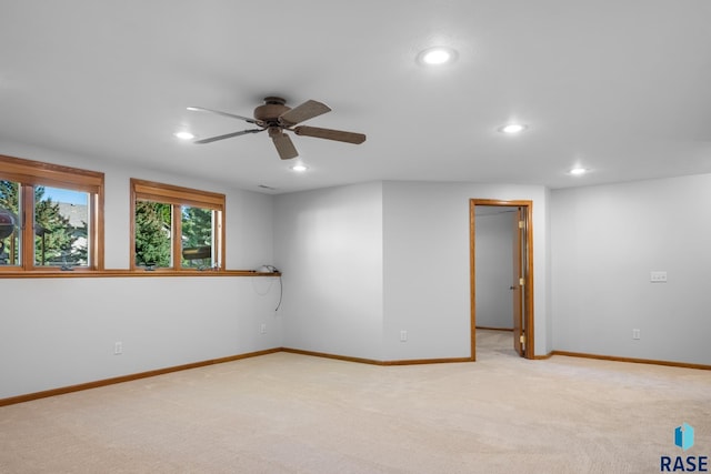 empty room featuring recessed lighting, baseboards, ceiling fan, and light colored carpet