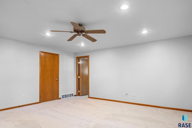 empty room featuring recessed lighting, visible vents, baseboards, and light colored carpet