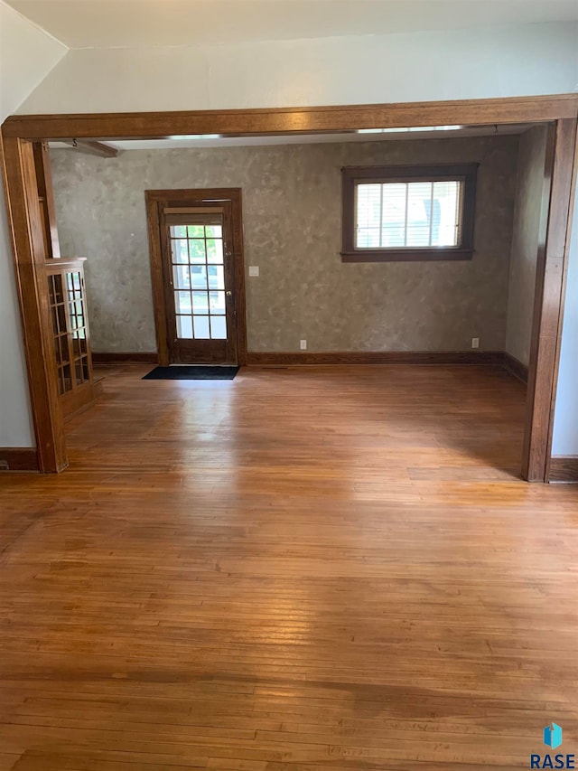 unfurnished room with light wood-type flooring