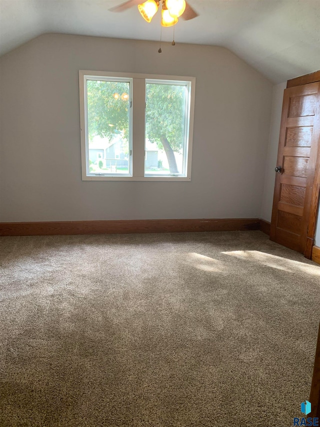 bonus room with lofted ceiling, carpet flooring, and ceiling fan