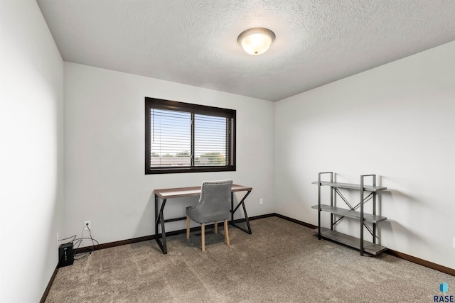 office area featuring carpet floors and a textured ceiling