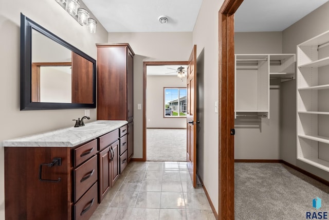 bathroom with vanity, ceiling fan, and tile patterned floors