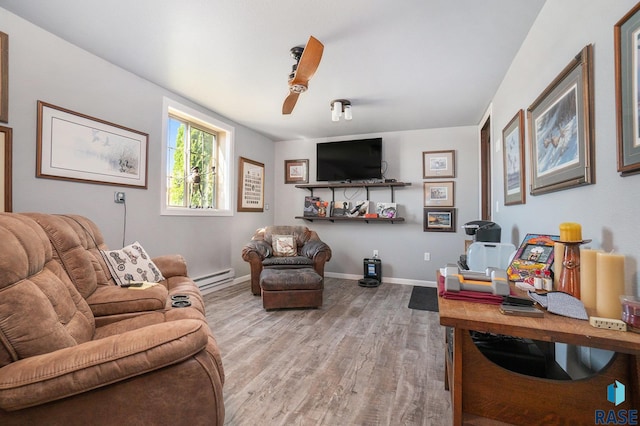 living room with a baseboard radiator, ceiling fan, and hardwood / wood-style floors