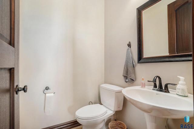 bathroom with toilet and sink