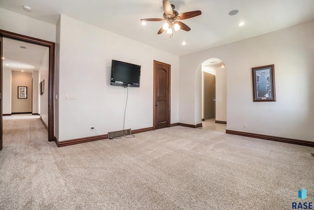 unfurnished bedroom with light carpet and ceiling fan