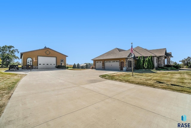 single story home with a front lawn and a garage