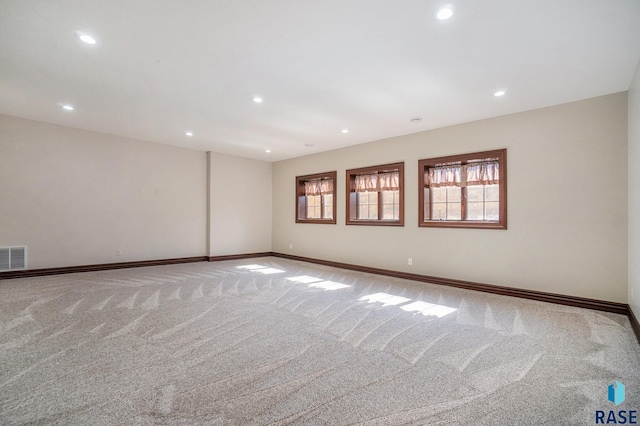 empty room with light colored carpet