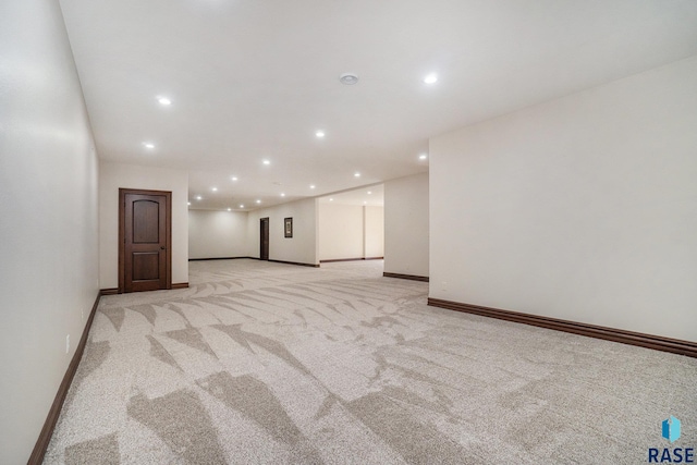 empty room featuring light carpet