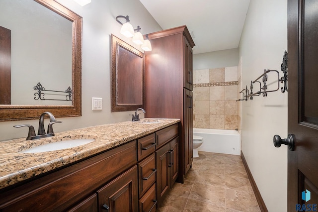 bathroom with a tub to relax in, vanity, and toilet