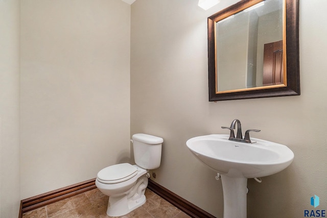 bathroom featuring tile patterned floors and toilet