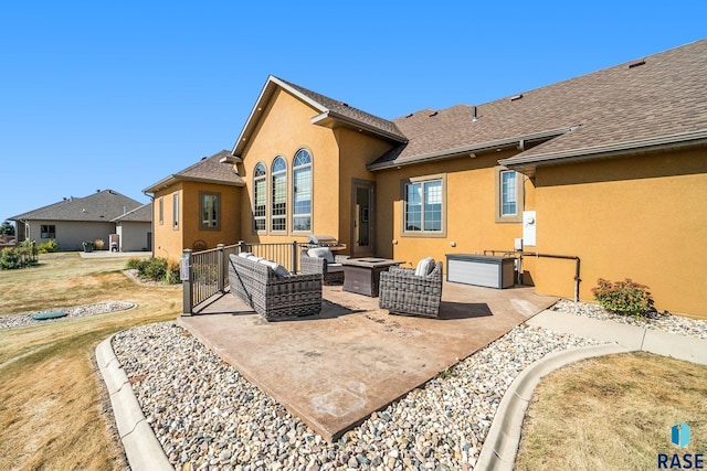 back of house with an outdoor living space