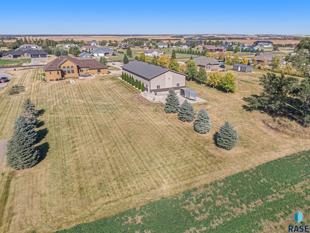 birds eye view of property with a rural view