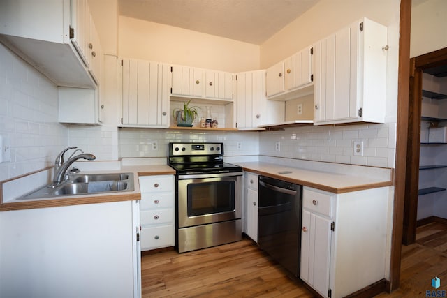 kitchen with light hardwood / wood-style flooring, dishwasher, stainless steel electric range oven, and white cabinets