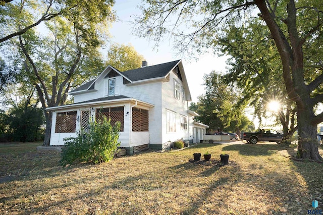 view of home's exterior featuring a lawn