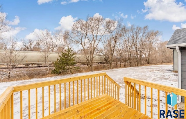 view of snow covered deck