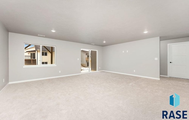 unfurnished room with light colored carpet