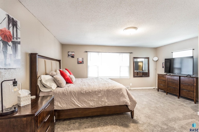 carpeted bedroom with a textured ceiling