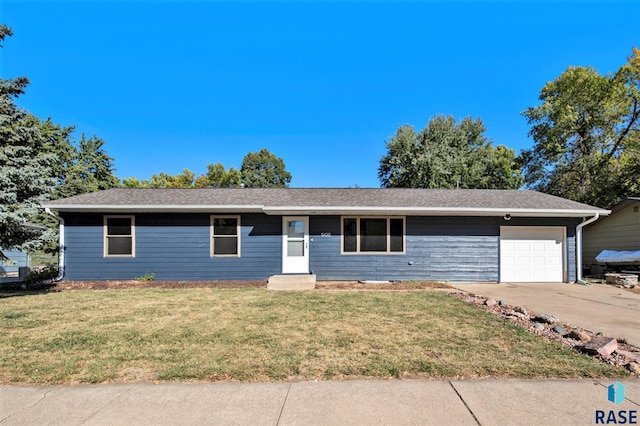 single story home with a garage and a front lawn