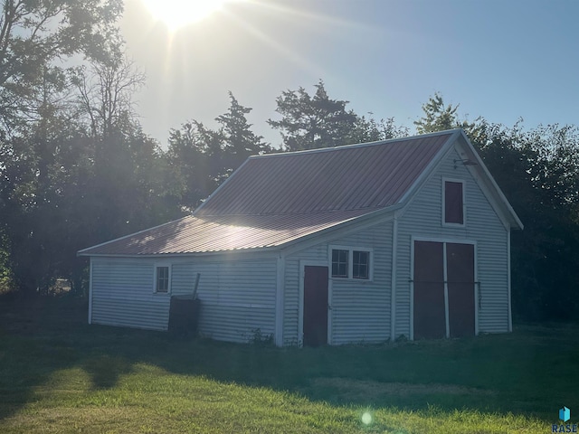 back of house with a yard