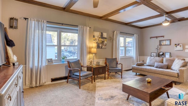 carpeted living room featuring coffered ceiling, ceiling fan, and beamed ceiling