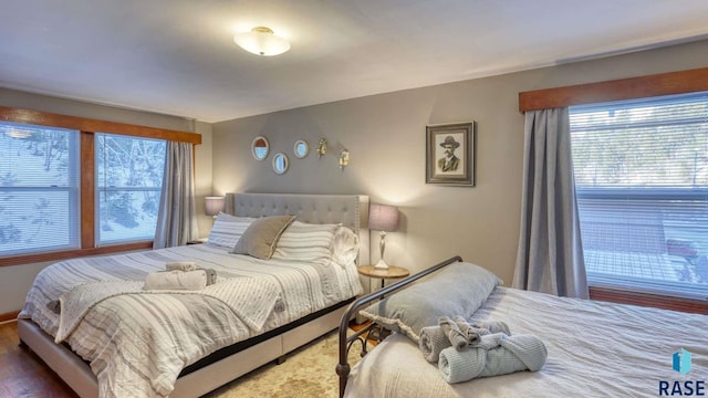 bedroom with hardwood / wood-style floors