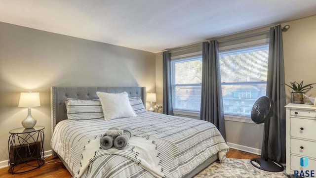 bedroom featuring dark wood-type flooring