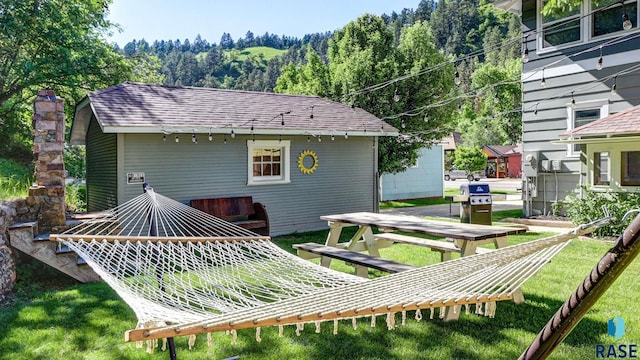 rear view of property featuring a lawn