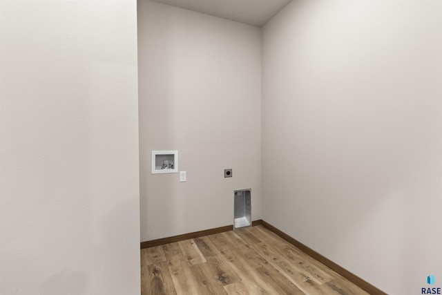 laundry room featuring laundry area, baseboards, hookup for a washing machine, hookup for an electric dryer, and light wood-type flooring