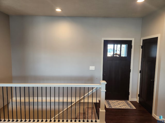 foyer entrance with dark wood-type flooring