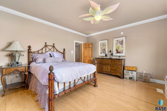 bedroom with light hardwood / wood-style flooring, ceiling fan, and crown molding