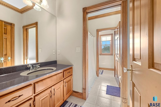 bathroom featuring vanity, tile patterned floors, ornamental molding, and a shower with shower curtain