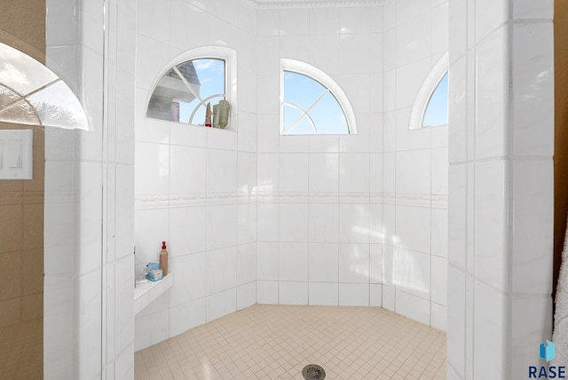 bathroom with tiled shower