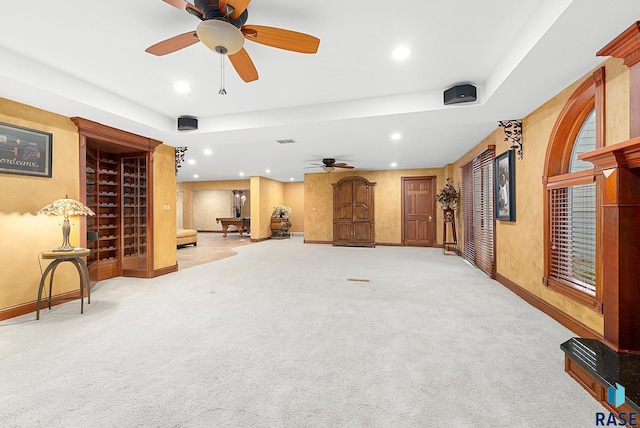 living room with ceiling fan and light carpet