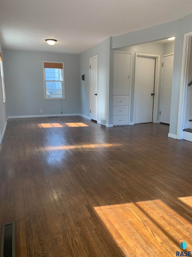 empty room featuring dark hardwood / wood-style floors