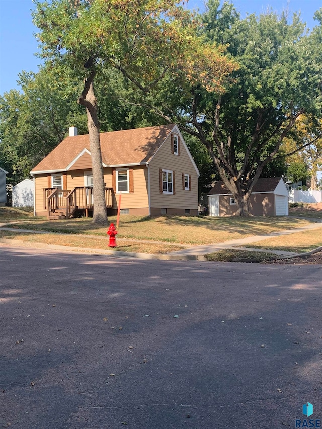 view of front of home with an outdoor structure and a garage