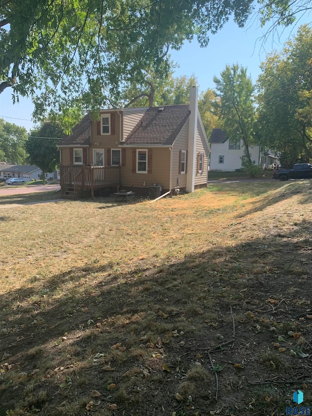 exterior space featuring a yard and a deck