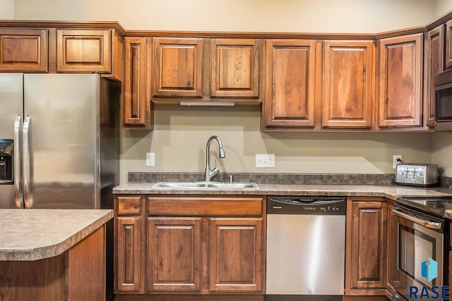 kitchen featuring appliances with stainless steel finishes and sink