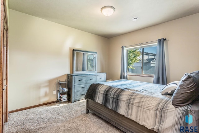 bedroom featuring light colored carpet