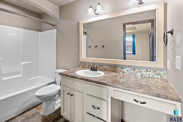 full bathroom featuring bathing tub / shower combination, toilet, decorative backsplash, and vanity