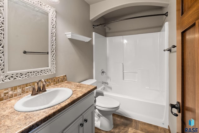 full bathroom featuring tasteful backsplash, toilet, shower / tub combination, and vanity