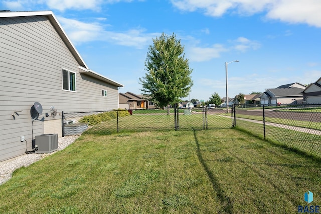 view of yard featuring central air condition unit