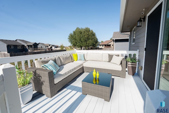 wooden deck featuring outdoor lounge area