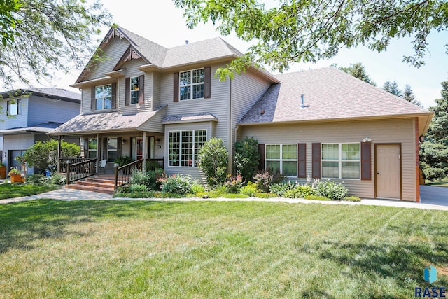 view of front of house with covered porch and a front yard