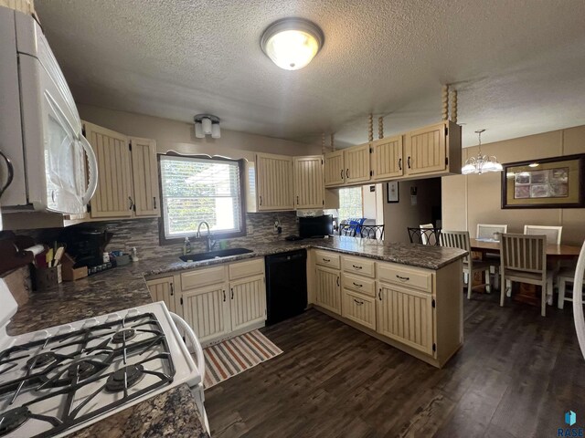 1495 115th St, Luverne, MN 56156 - kitchen featuring dishwasher, range with gas stovetop, a sink, a peninsula, and a textured ceiling