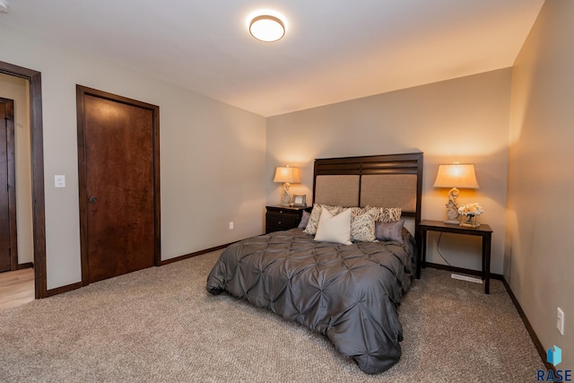 bedroom featuring light carpet