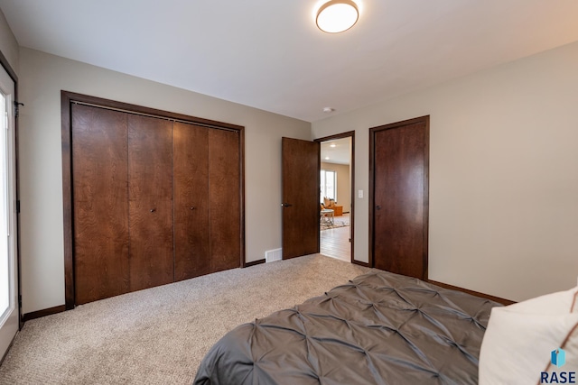 bedroom with a closet and carpet flooring