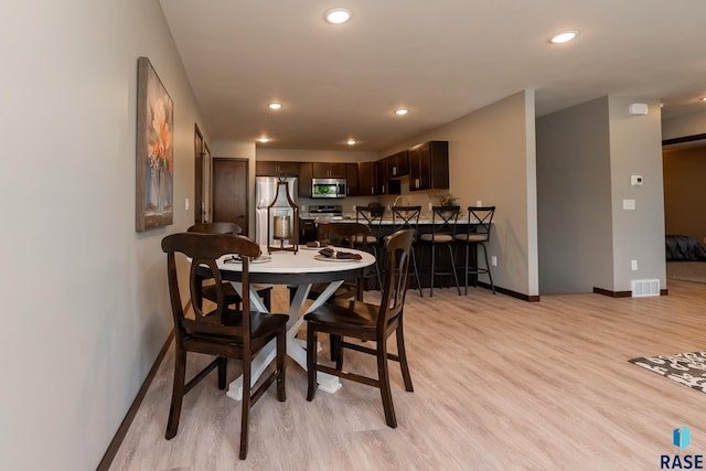 dining area featuring light hardwood / wood-style floors