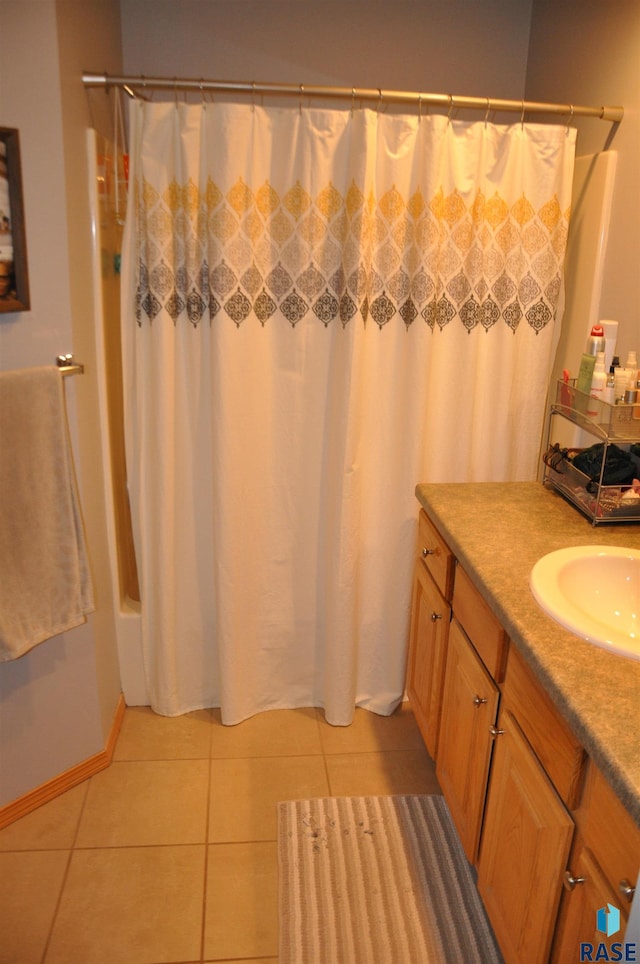 bathroom with vanity, shower / bath combo, and tile patterned floors